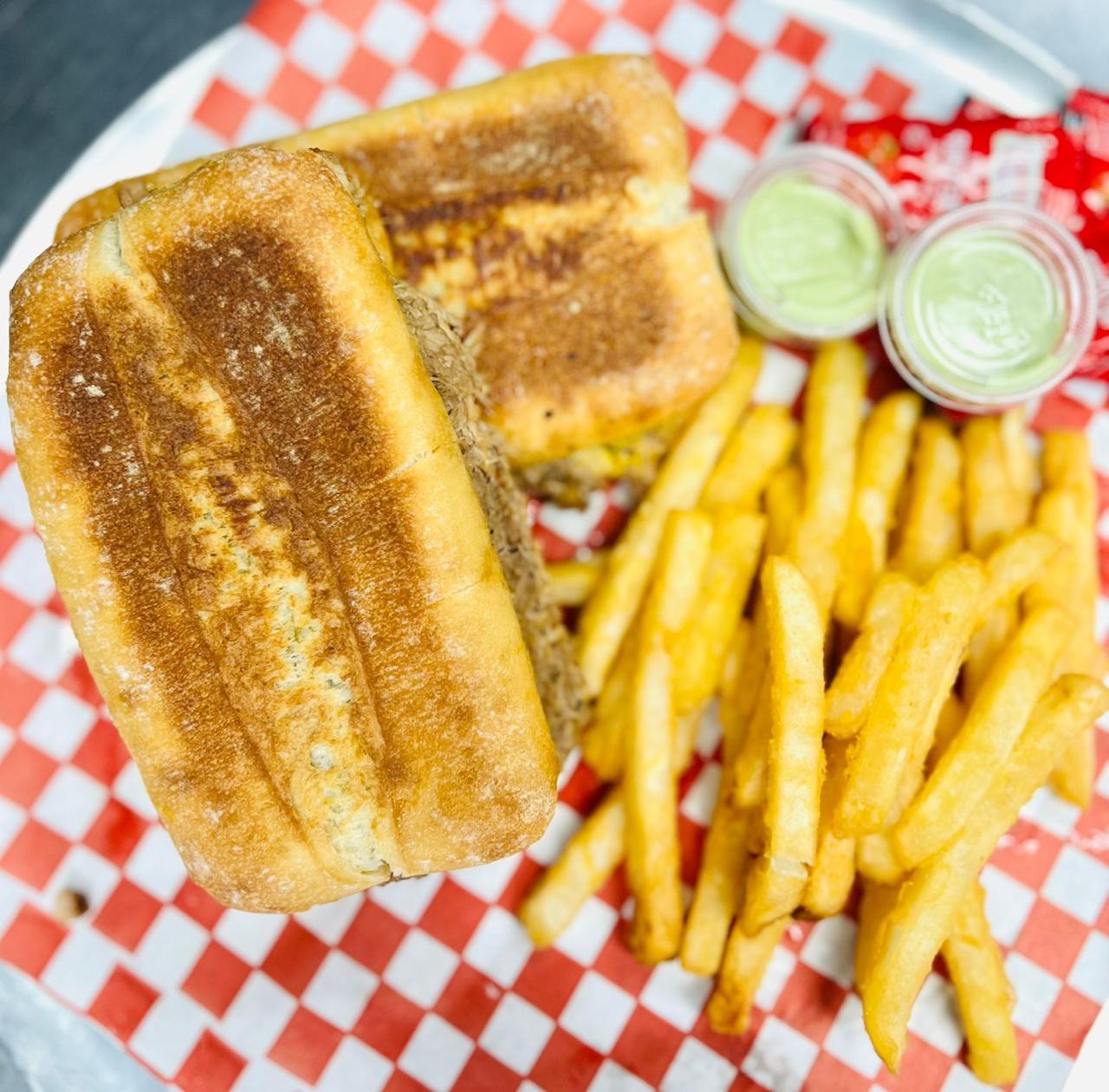 Carnitas Sandwich at Salsa and Sabor Kelowna BC - Slow-cooked pork carnitas with traditional Mexican flavors on a fresh torta roll